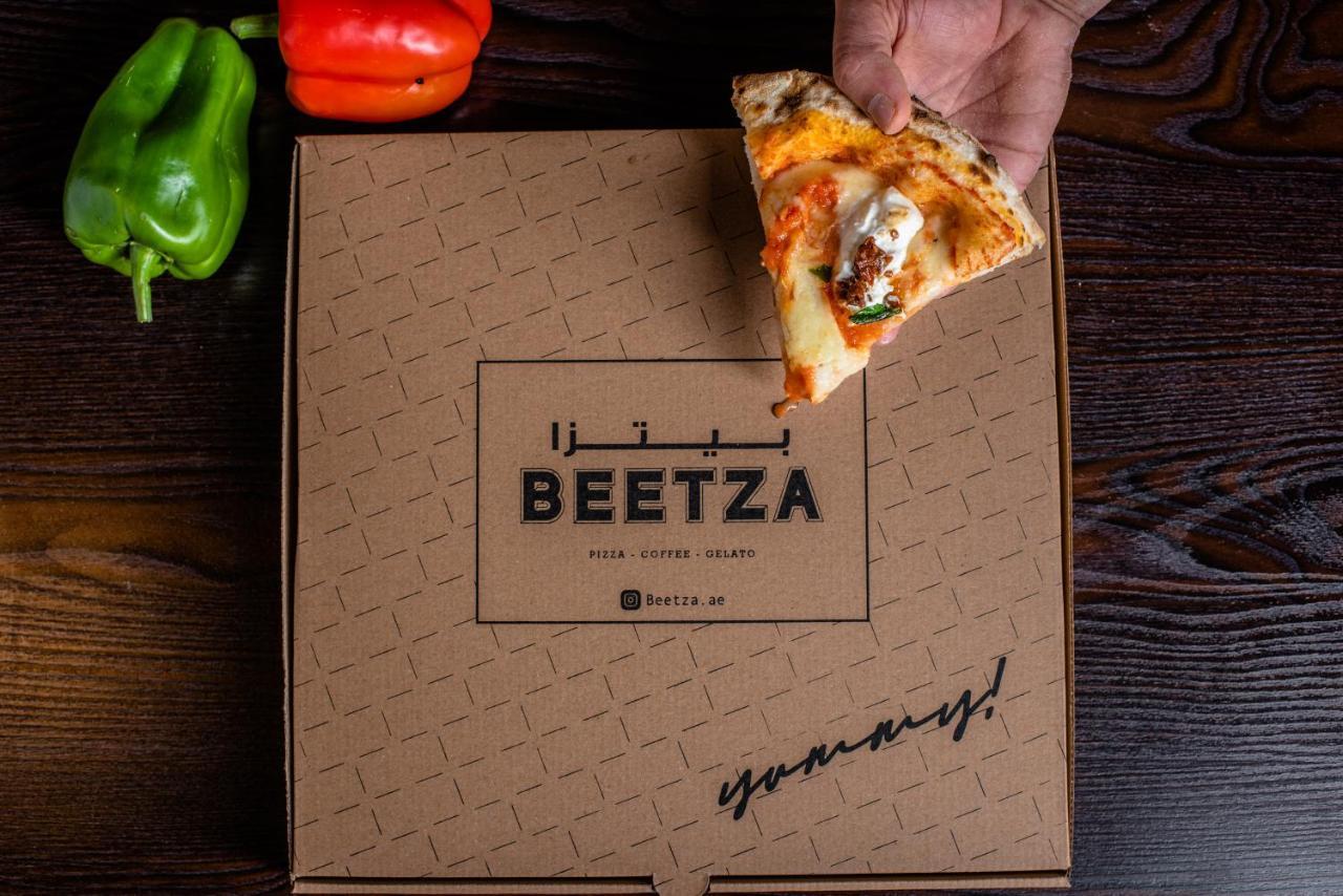Officers Club & Hotel Abu Dabi Dış mekan fotoğraf Beetza pizza